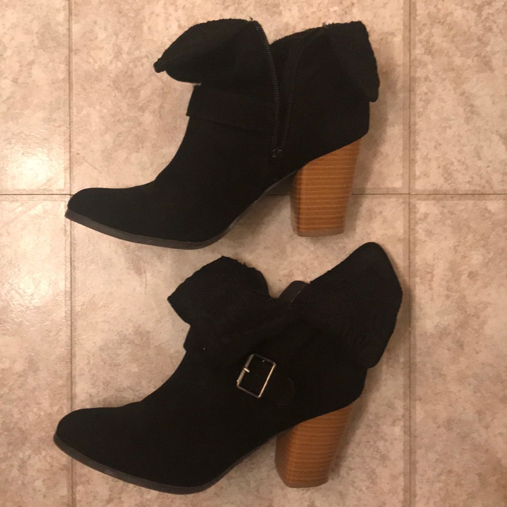 Black booties with a brown heel
